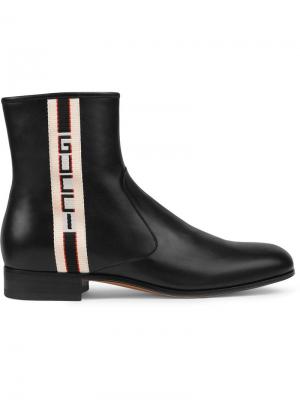 Ботинки с логотипом Gucci. Цвет: черный