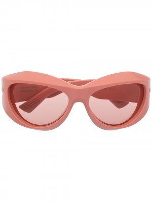 Солнцезащитные очки в овальной оправе Bottega Veneta Eyewear. Цвет: розовый