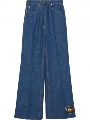 Расклешенные джинсы с логотипом Gucci. Цвет: синий