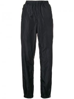 Спортивные брюки с полосками и логотипом Prada. Цвет: черный